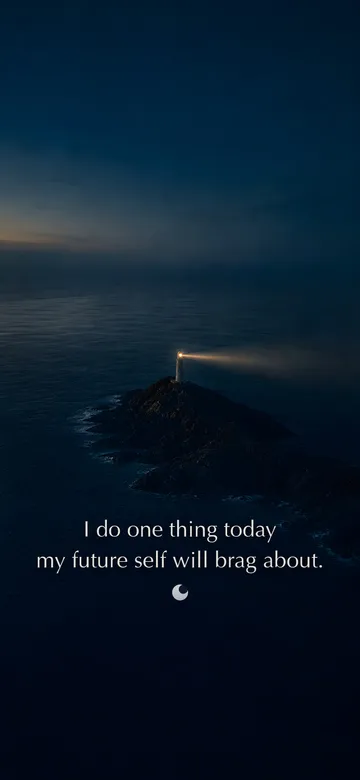 Morning affirmations wallpaper — dawn aerial photograph of a lighthouse on a dark headland at the edge of dawn, its beam still turning over a calm sea, with the affirmation 'I do one thing today my future self will brag about.' in serif type.