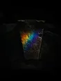 Refracted-light photograph: refracted light catching the keystone of a dark stone archway.