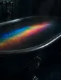 Refracted-light photograph: a bath filled to the brim, a band of refracted light lying across the still water.
