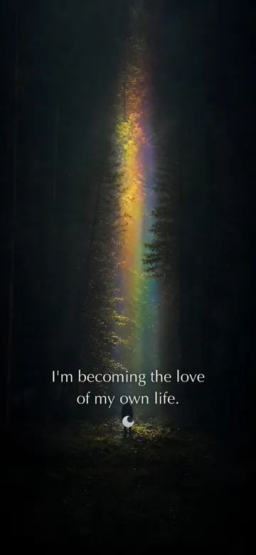 Self-love affirmations wallpaper — refracted-light photograph of a lone figure in a dark forest clearing facing a tall veil of prismatic light between the trees, with the affirmation 'I'm becoming the love of my own life.' in serif type.