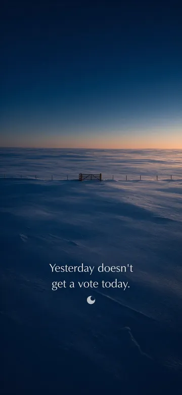 Morning affirmations wallpaper — dawn aerial photograph of a field of untouched overnight snow at dawn with one wooden gate in a fence line, with the affirmation 'Yesterday doesn't get a vote today.' in serif type.