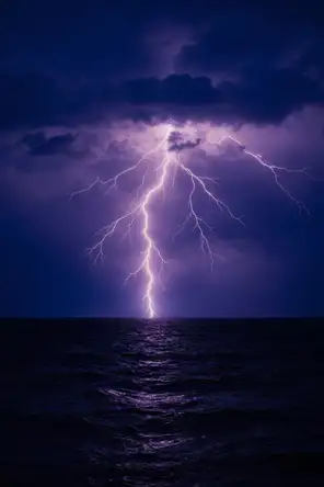 Film photograph: a single brilliant lightning strike frozen over a dark sea under a deep violet night sky.