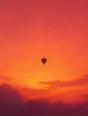 Grainy gradient illustration: A hot-air balloon drifting small and unhurried in a huge amber-rose dawn sky.