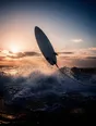 Motion photograph: a surfboard flipping up out of white water in shallow surf at first light, its leash taut and the wave still running