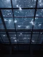 Motion photograph: hail hammering down on a glass roof at midday seen from directly beneath, each stone exploding on impact