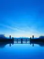 Grainy gradient illustration: A weir gate closed across a calm canal, the water above it flat and still, morning blue sky reflected.