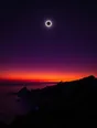 Film photograph: a total solar eclipse in a deep violet sky, its silver corona blazing over a dark coastal headland.
