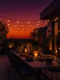 Film photograph: a long terrace table set generously for dinner under warm string lights and an amber and plum dusk sky.