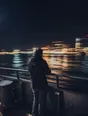 Motion photograph: a man alone at the rail on the open deck of a night ferry, city lights and black water passing him fast