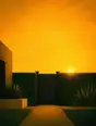 Grainy gradient illustration: A garden gate closed for the evening, low golden sun sitting just behind the hedge.
