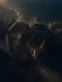 Dawn aerial photograph: wet slate village rooftops steaming in the first sun after night rain.