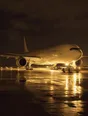 Struck-light photograph: an aircraft being pushed back at dusk with the ground lighting raking underneath it