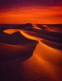 Film photograph: wind-carved desert dunes at sunset, curves in golden light and deep shadow under an amber and rose sky.