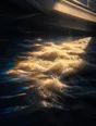 Prism-light photograph: A river in spate running under a bridge with hard sun on the churn of the water.