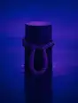 Grainy gradient illustration: A single mooring post with its rope loop waiting in still violet water.