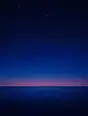 Grainy gradient illustration: Stars thickening from the horizon up to the top of the sky over a calm dark empty sea, the horizon completely bare, nothing standing in the water.