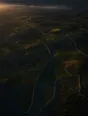 Dawn aerial photograph: a vast web of drystone field walls spread over rolling hills at sunrise.
