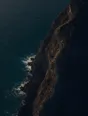 Dawn aerial photograph: old stone steps carved into a sea cliff, climbing and curving out of sight.